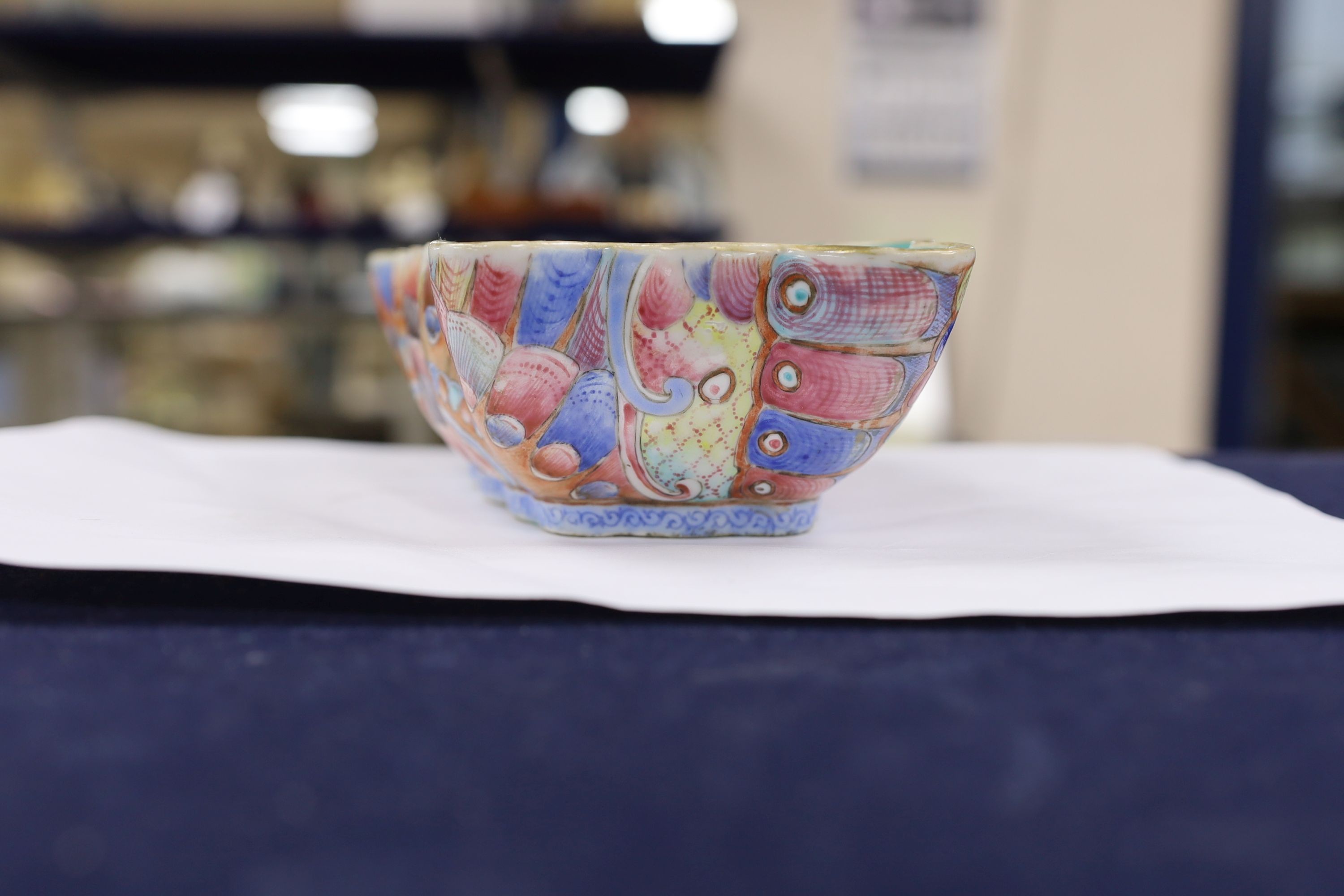 A Chinese enamelled porcelain ‘butterfly’ dish, 19th century, ground off reign mark, 19 cms wide at the front.